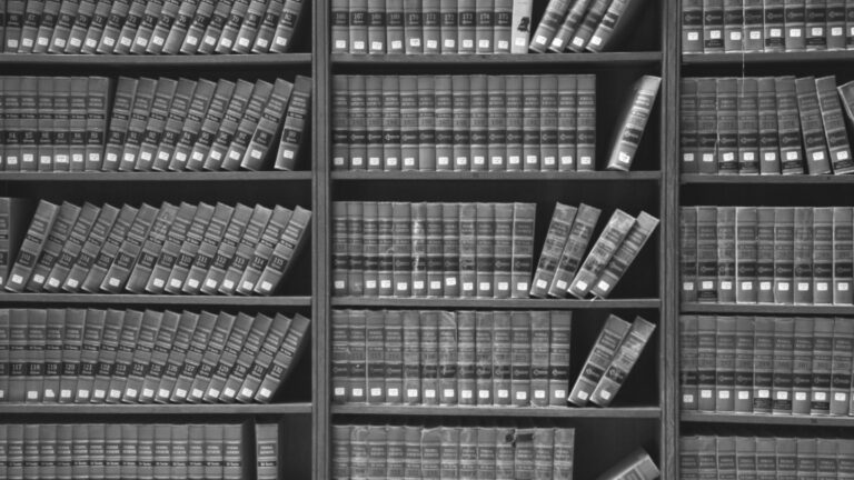Investor reviewing documents during FINRA arbitration discovery process with securities lawyer